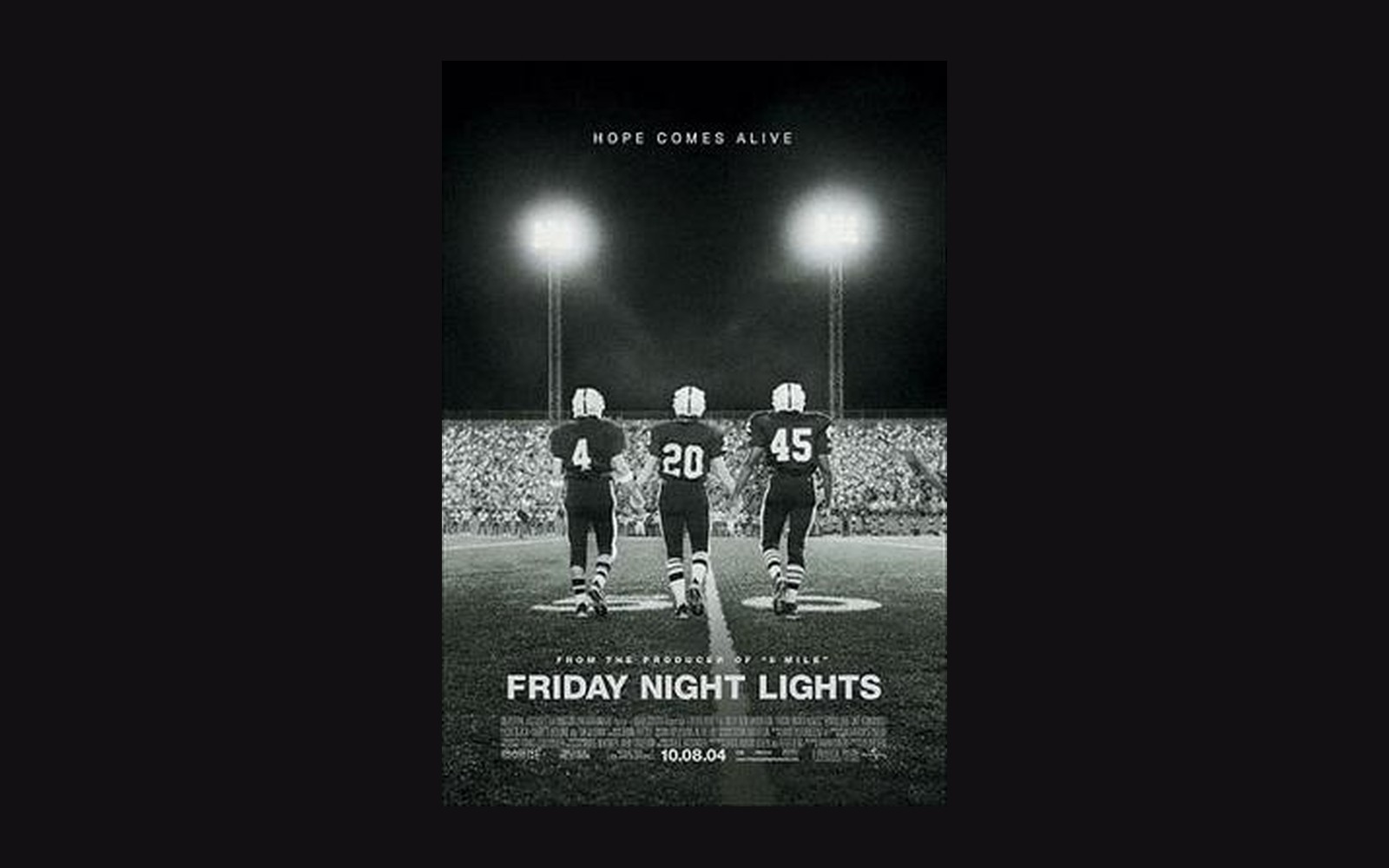The 2004 Friday Night Lights film one-sheet, photographed flat on a light surface at poster scale